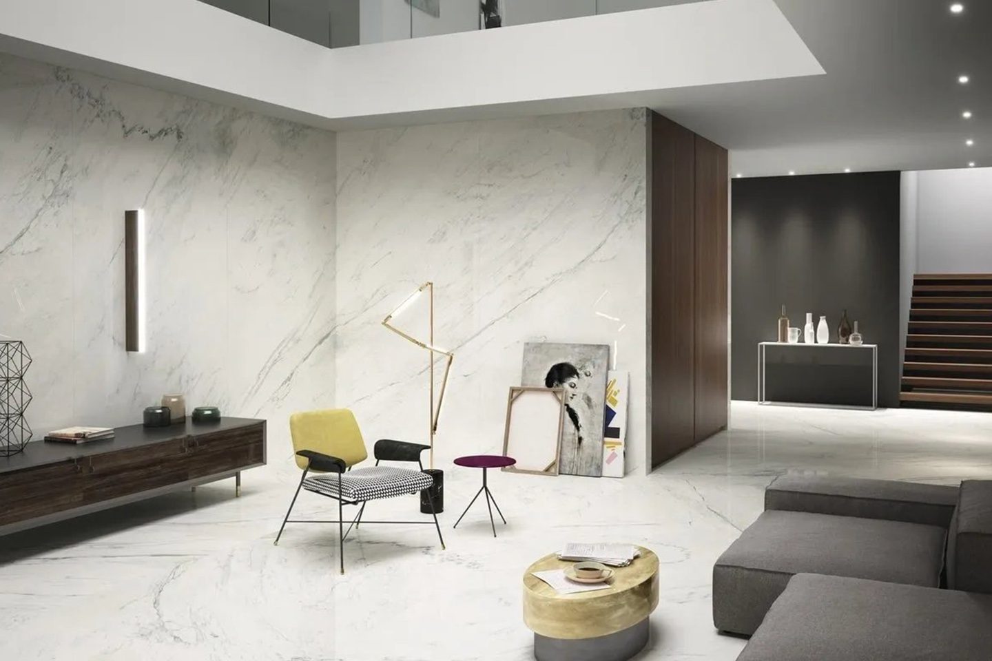 A living room with white walls and marble floors