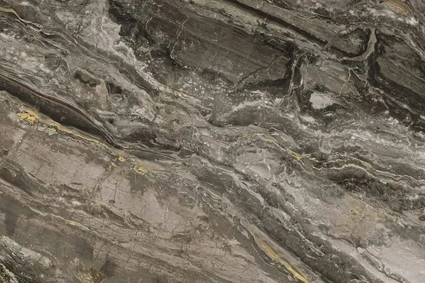 A close up of the rock face of a mountain