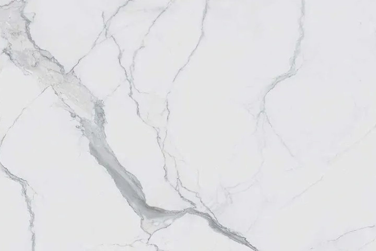 A white marble floor with a gray vein.