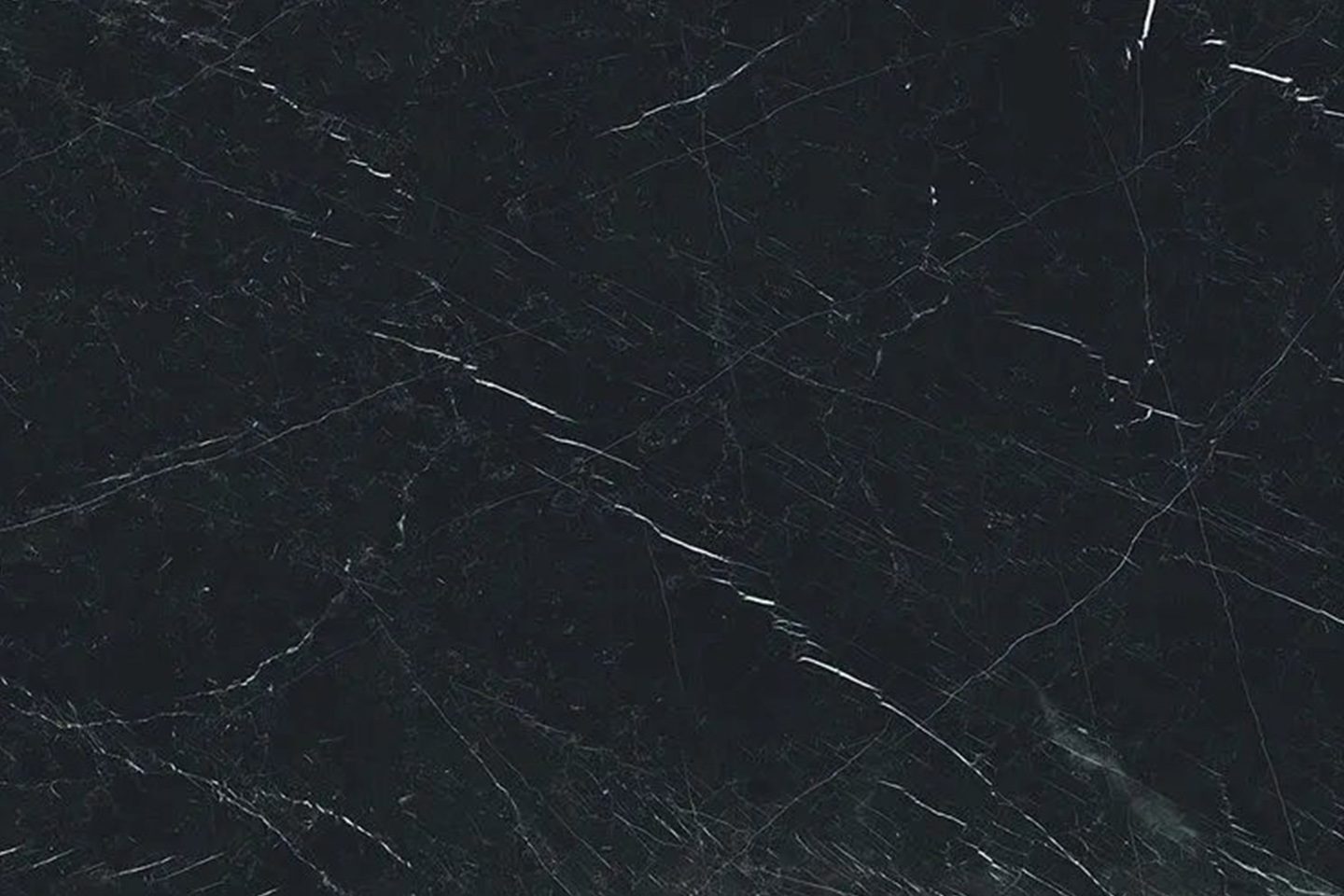 A black marble surface with some white lines