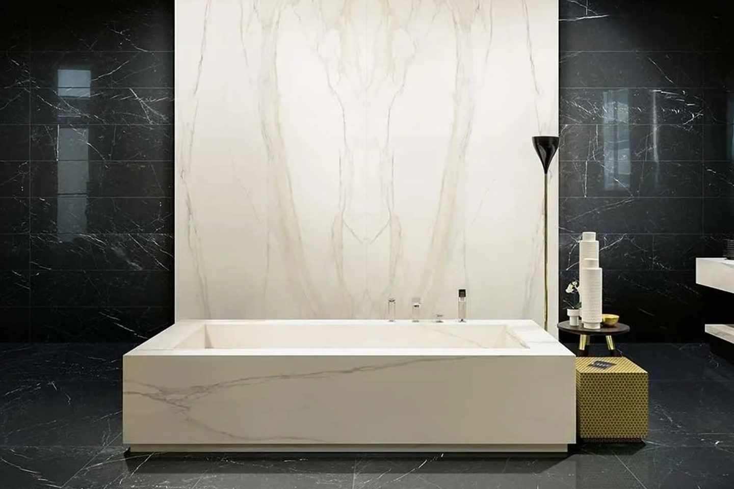 A white bathtub sitting in front of a black wall.